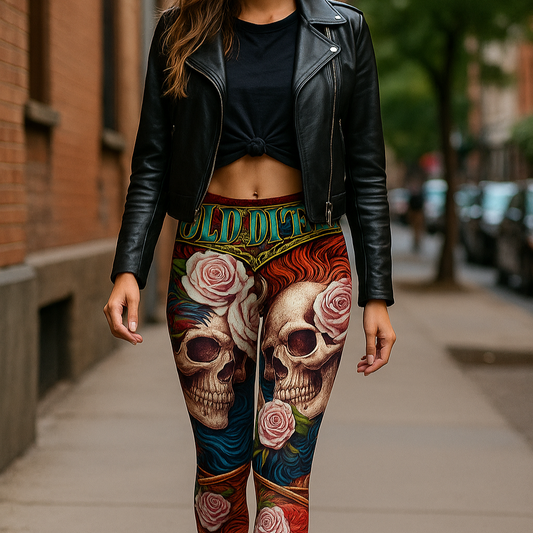 Person wearing colorful leggings with skull and floral designs on a sidewalk.